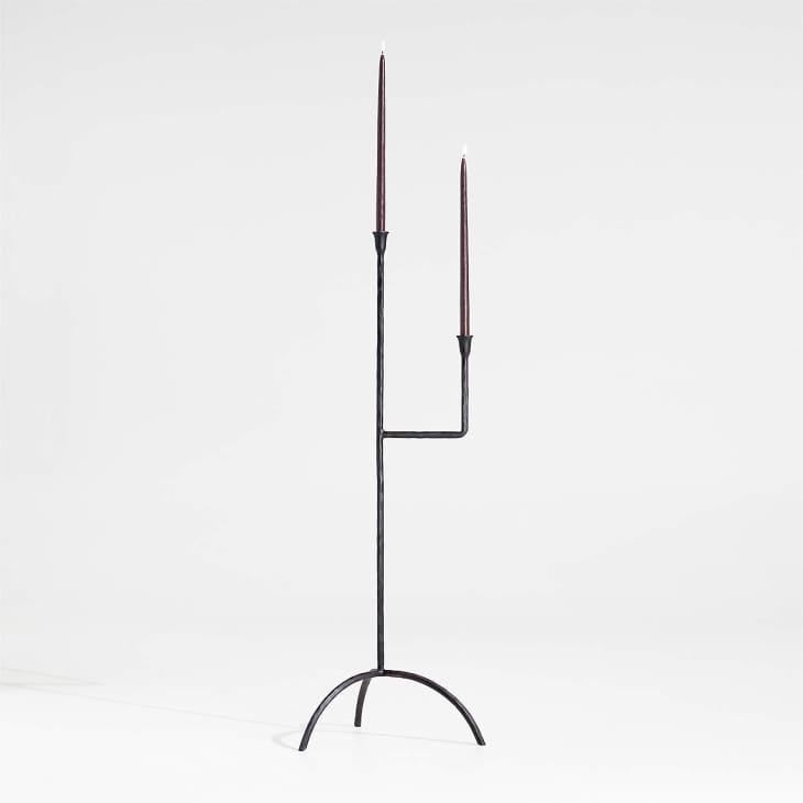 Angular black iron 2-pronged floor candle holder from Athena Calderone's Crate &amp; Barrell collection