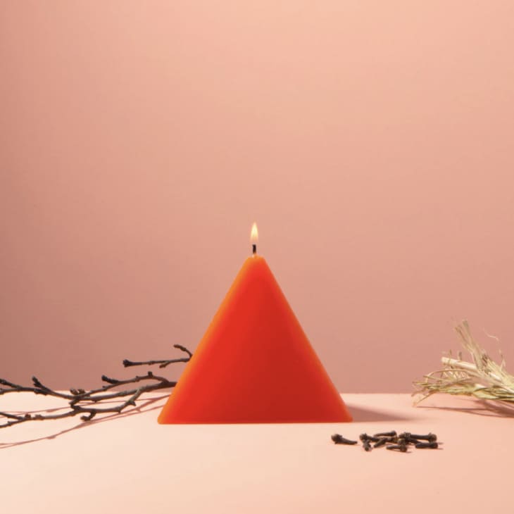Orange pyramid shaped candle from 54 Celsius