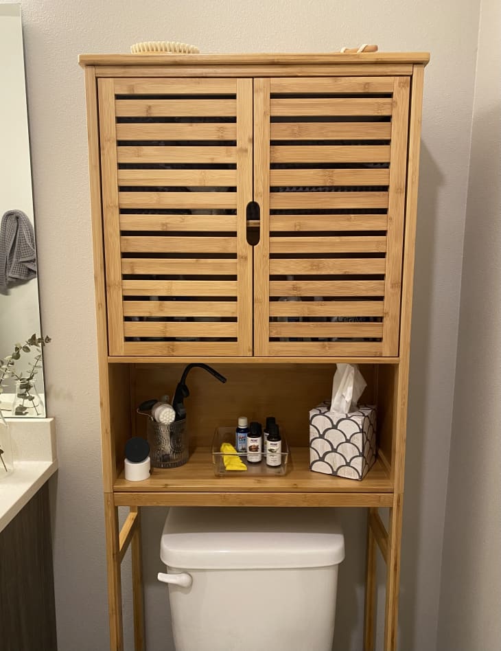 Bathroom storage cabinet system above toilet.