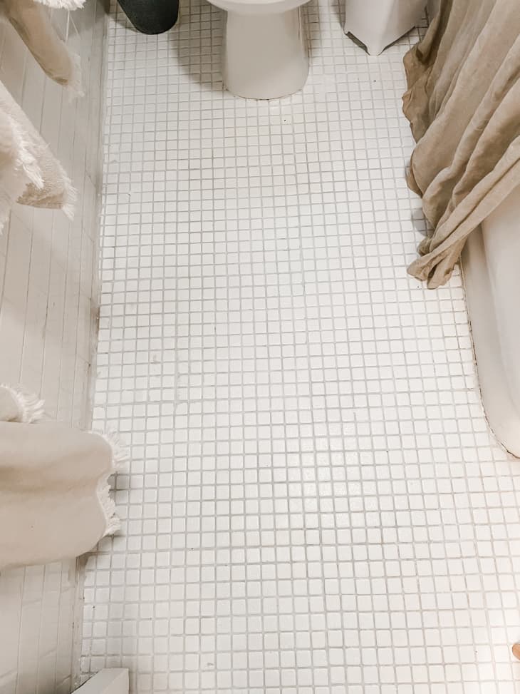 Clean white tile in vintage bathroom.
