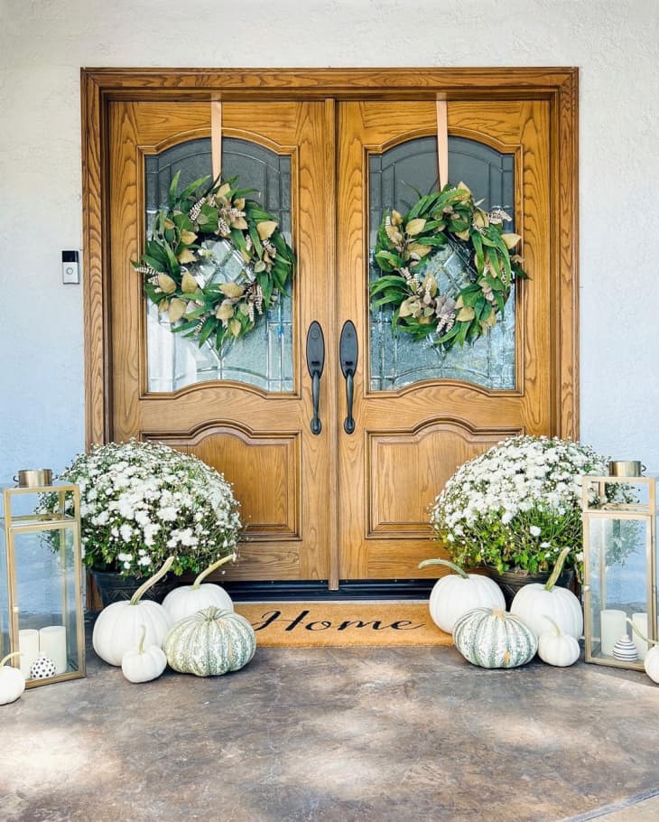 front door with wreaths, bouquets, white pumpkins
