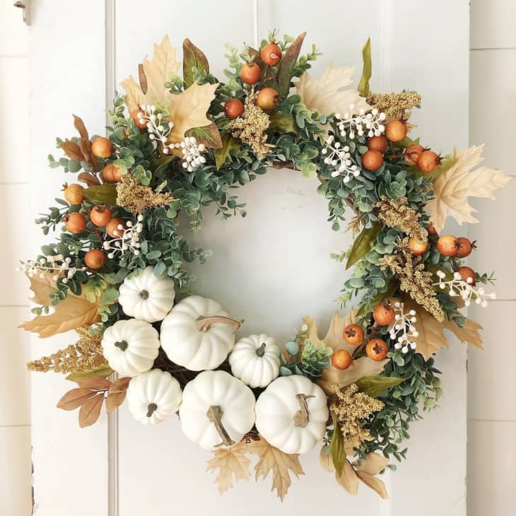 door wreath with white pumpkins and other foliage