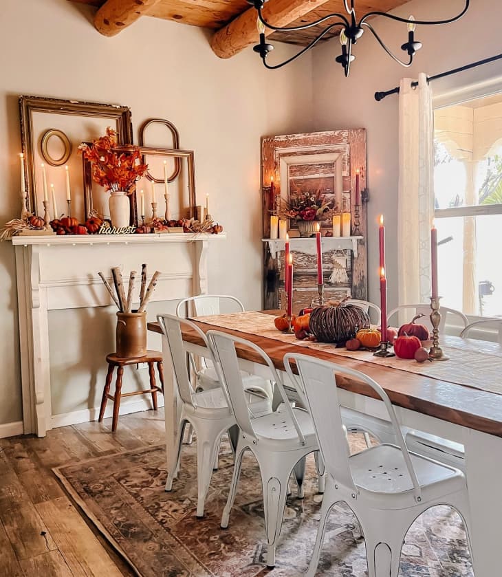 Dining room decorated with pumpkins, candles, fall decor