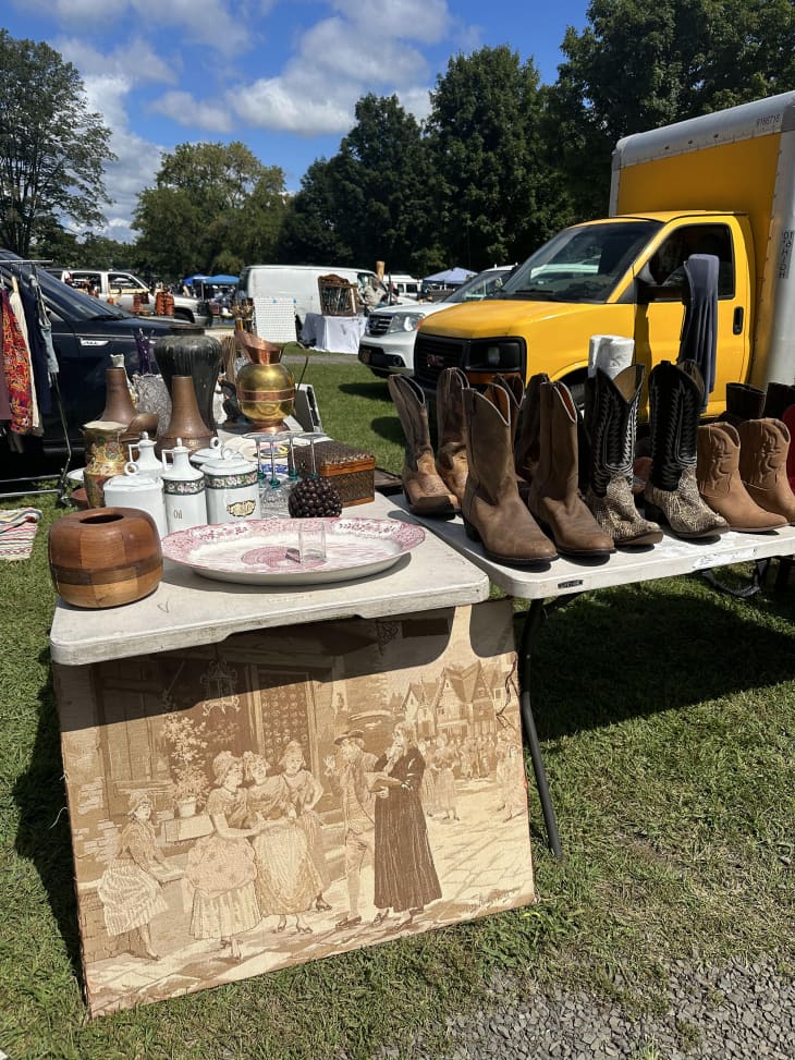 tables with cowboy boots, other vintage wares at the Elephant’s Trunk Flea Market in Connecticut