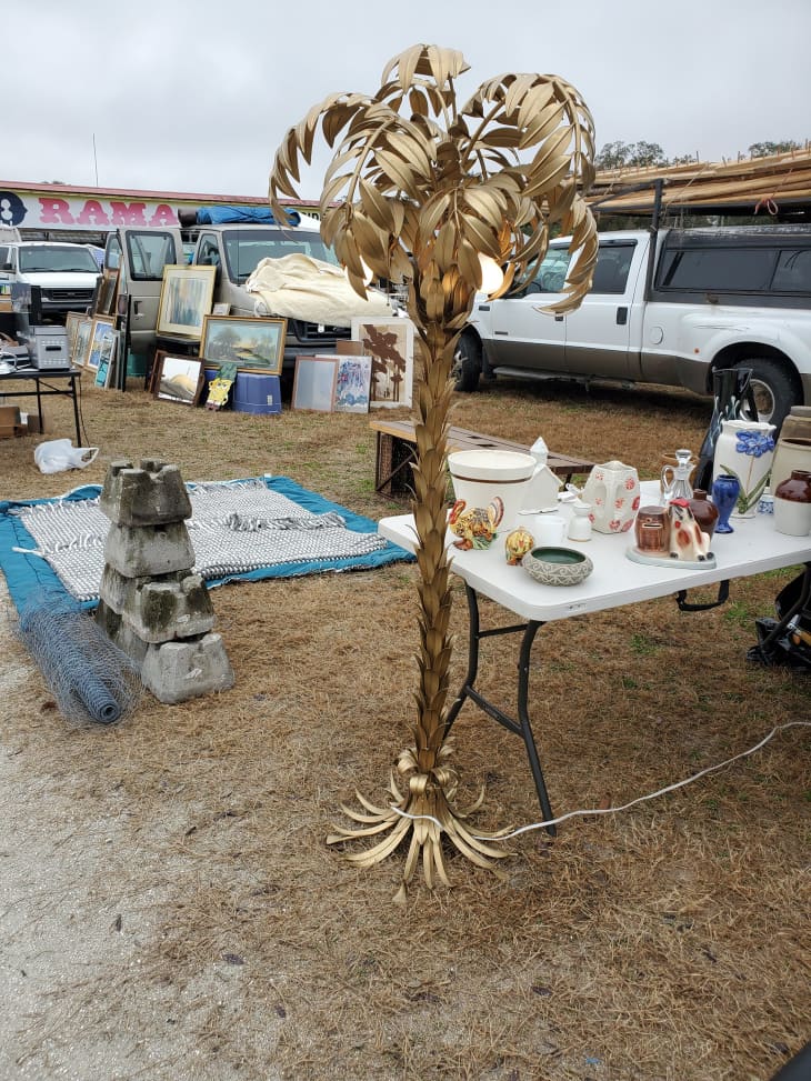 Gold palm tree lamp, art, and other goods at the Florida Swap-O-Rama Webster Westside Flea Market