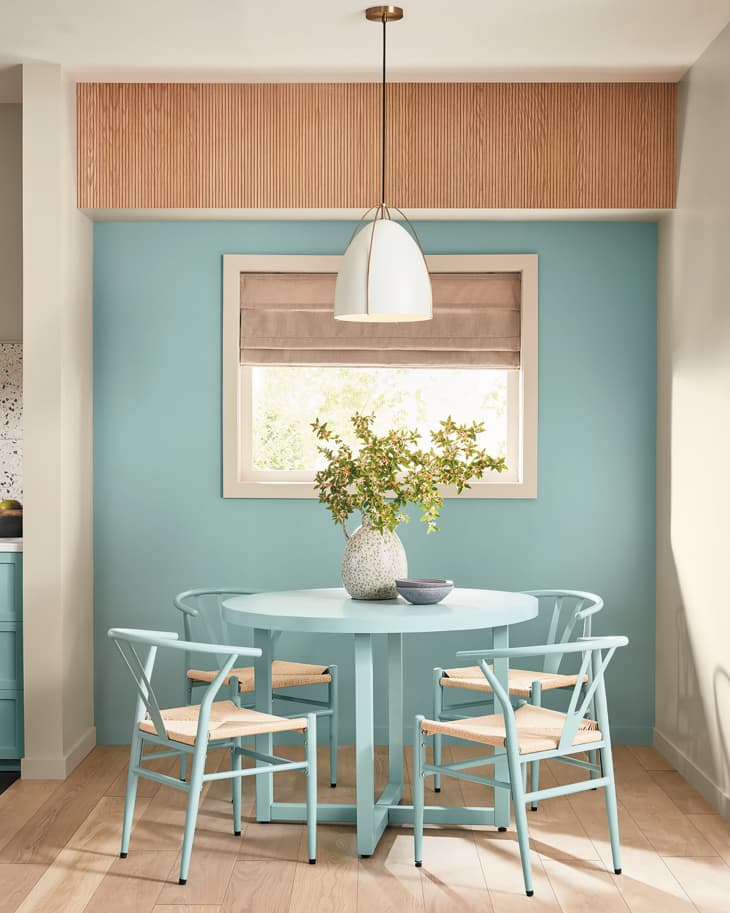 Dining room and table painted in Renew Blue, Valspar's color of the year.