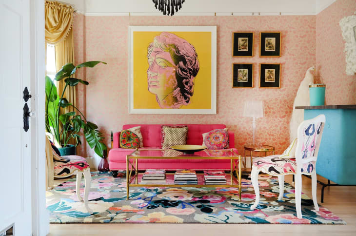 a living room with bold pink, yellow, blue, and green colored decor