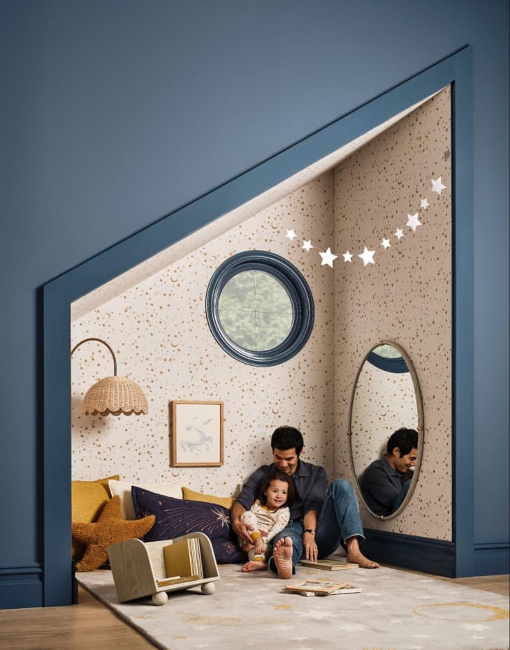 parent with child in blue and white kids' room with west elm kids collection designed by joseph altuzarra