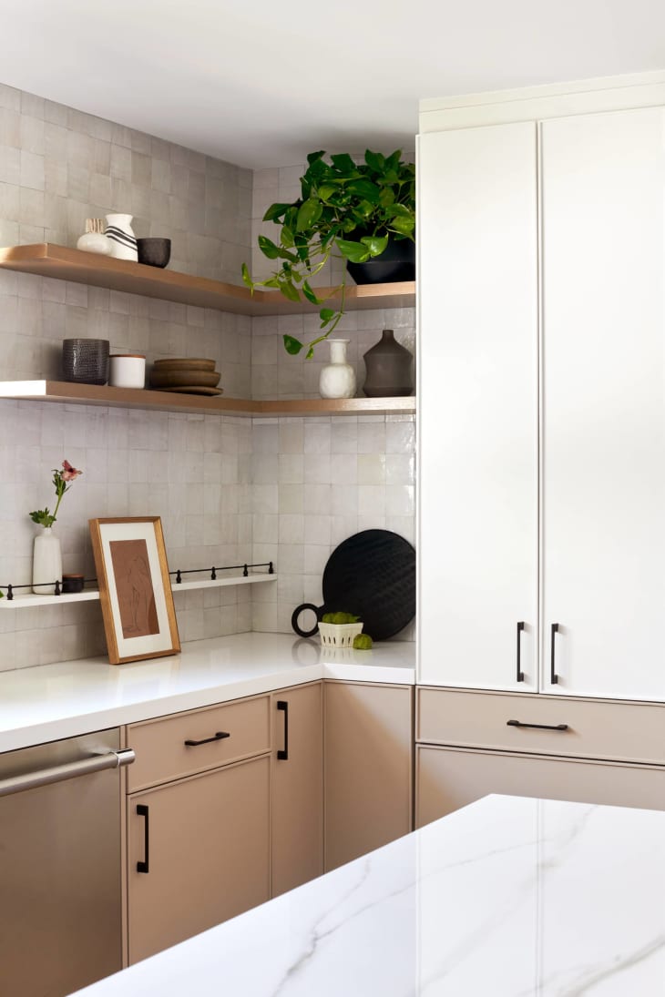 cream cabinets with tan lower cabinets and exposed shelving
