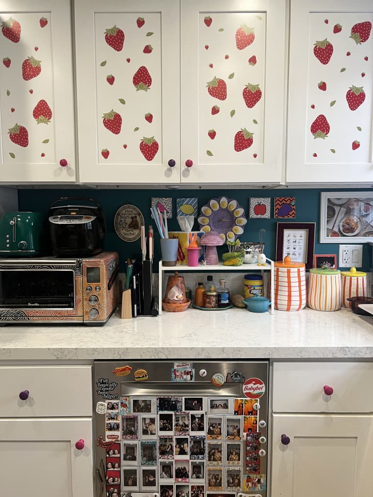 White kitchen cabinets with renter-friendly strawberry decals