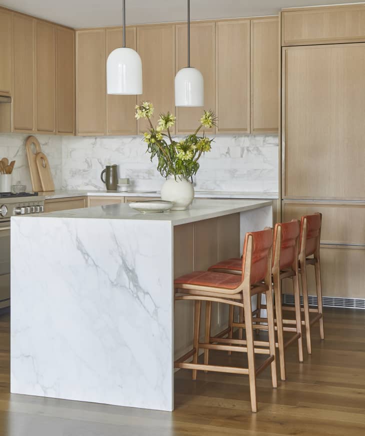 Kitchen with white/gray marble backsplash and kitchen island