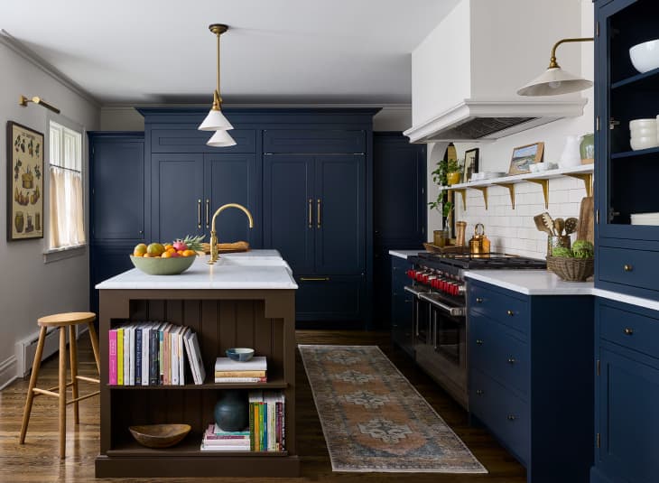 Kitchen with deep navy cabinets and drawers