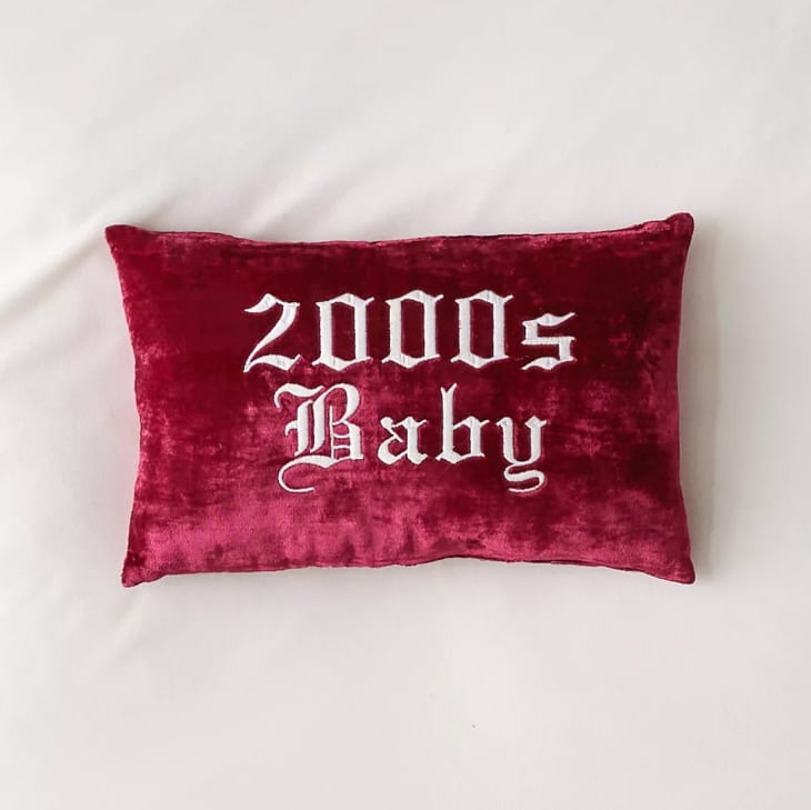 https://cdn.apartmenttherapy.info/image/upload/f_auto,q_auto:eco,w_730/at%2Fstyle%2F2023-12%2Fy2k-home-gift-guide%2Fy2k-baby-throw-pillow