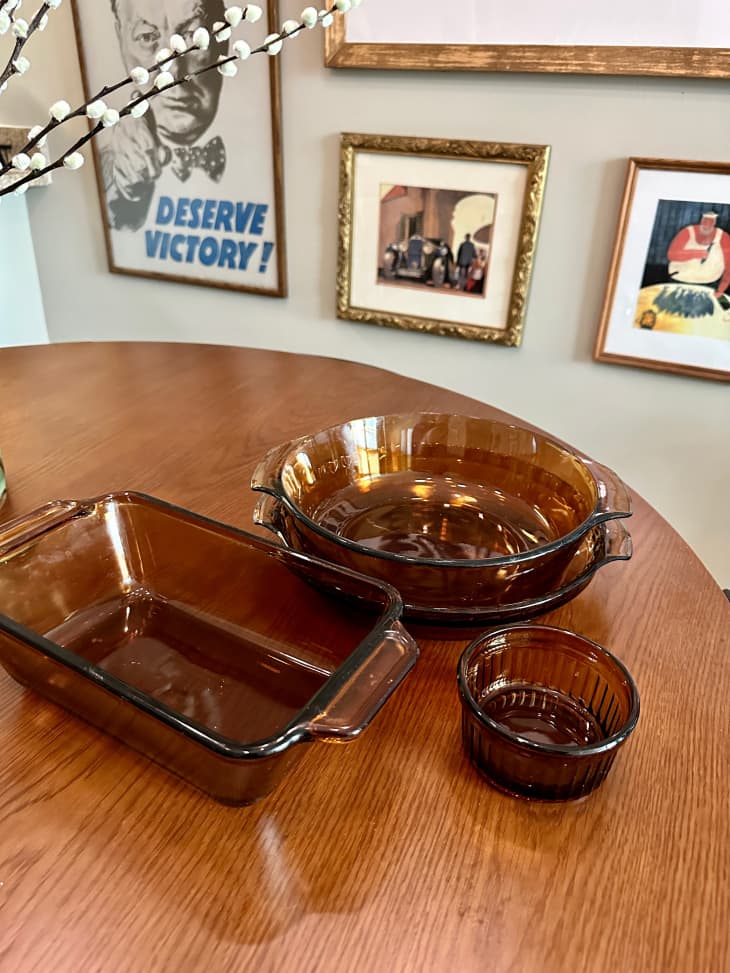 Vintage amber glass bakeware and dishware on wood table