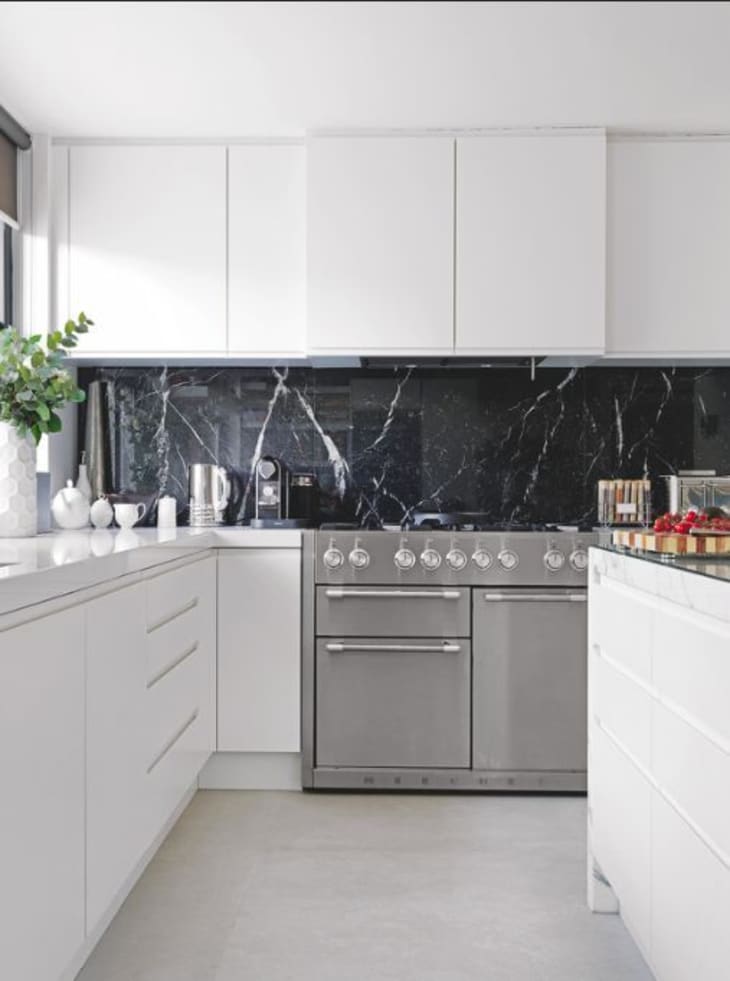 Black marble store white cabinets