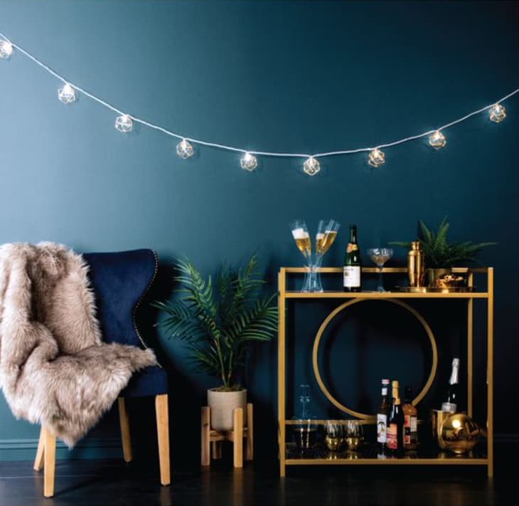 Hanging string lights in living sale room