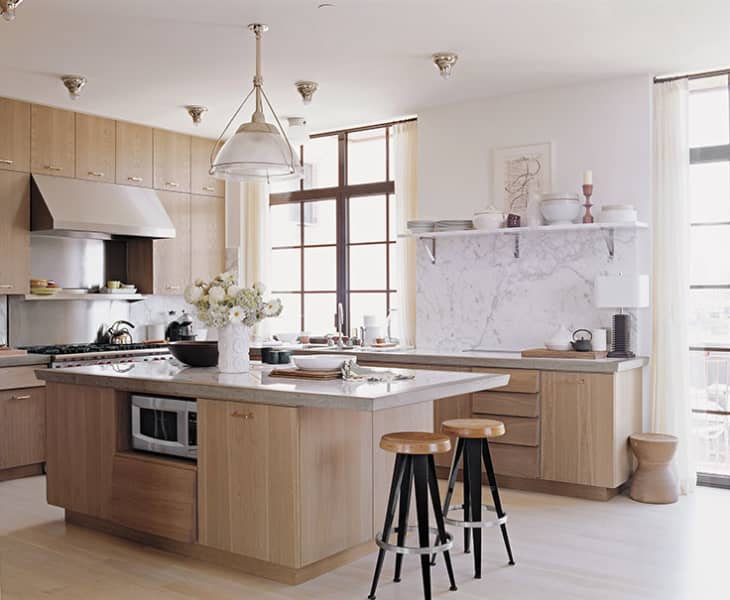 light natural wood kitchen cabinet and yellow walls