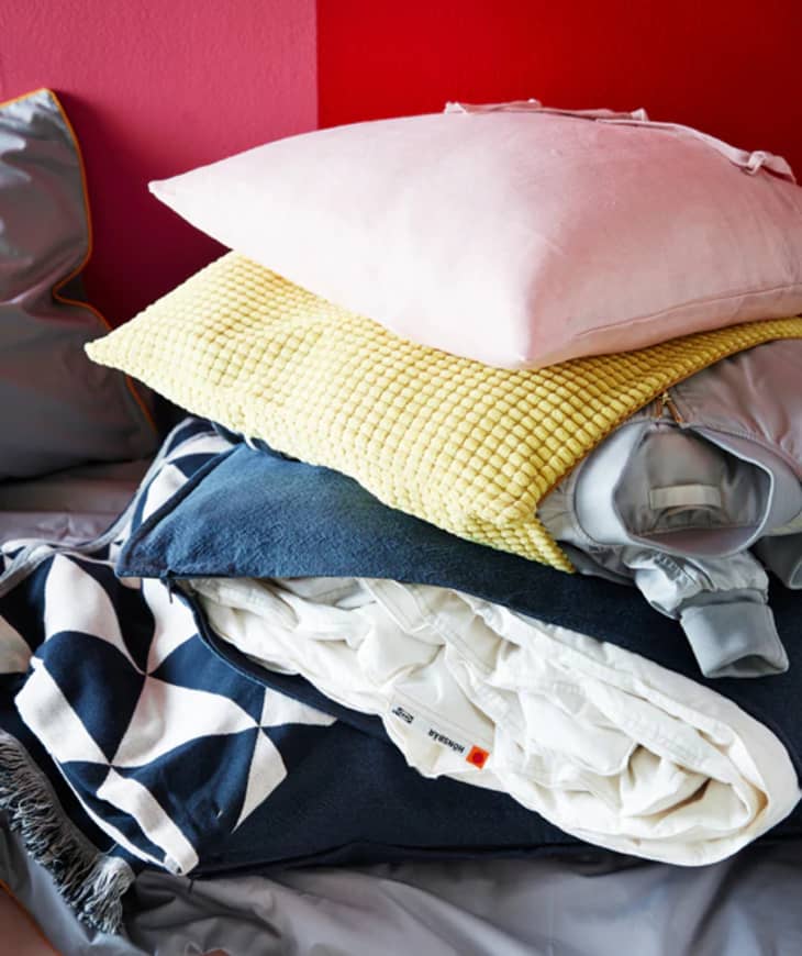 How to Store and Hide Your Extra Clothes and Sheets Inside a Throw