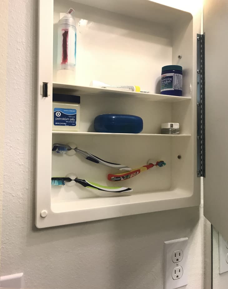 Repurpose Cable Clips to Organize Toothbrushes in the Bathroom