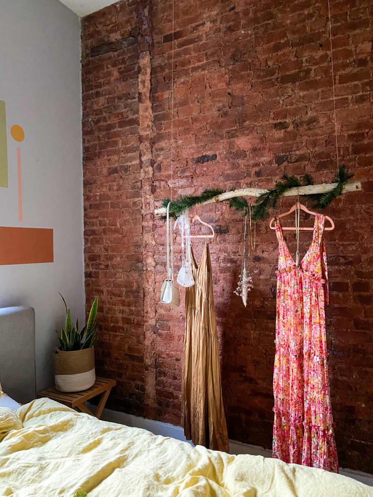 How to Fill a Bare Bedroom Wall With a DIY Birch Hanging Clothing Rack ...