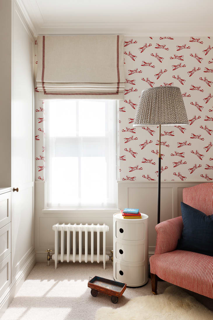 Animal wallpaper with red trim roman shade kids room