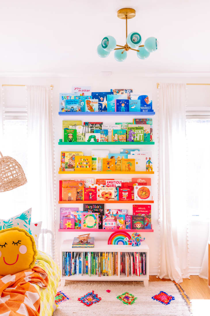 Colorful rainbow bookshelves with color coordinated books