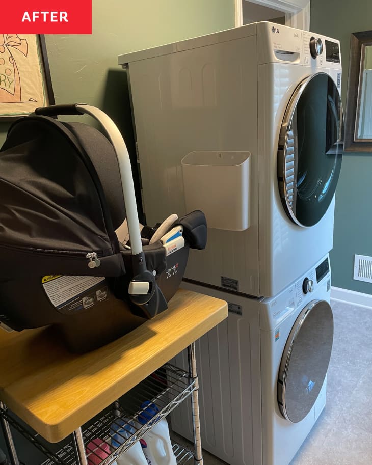 laundry room with washer dryer and carseat
