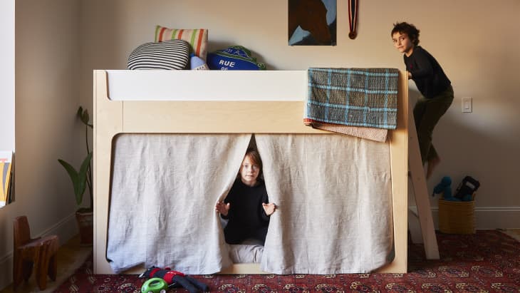 Oeuf Perch Nest Bed in kids' room. Kids playing on and around
