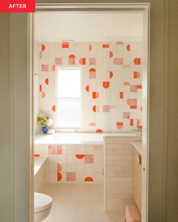 Colorful sunset colored tiles in kids bathroom after renovation.