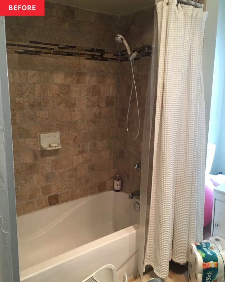 Shower with beige tiles before renovation.