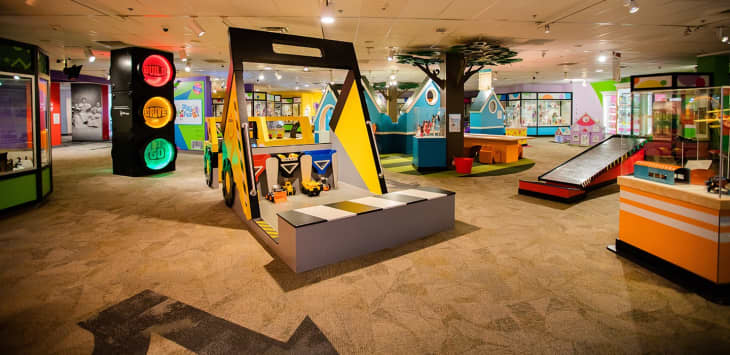 Interior of The Strong, Rochester, New York. Lots of colorful interactive displays for children in a large room
