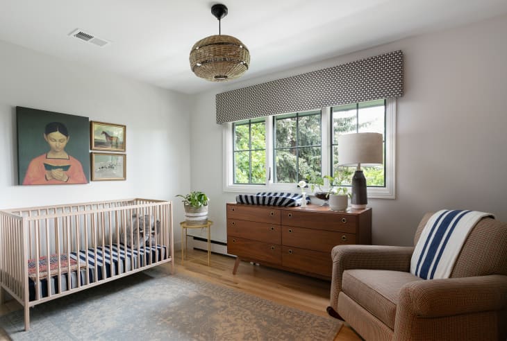 nursery with clean lines, vintage art, and subtle colors