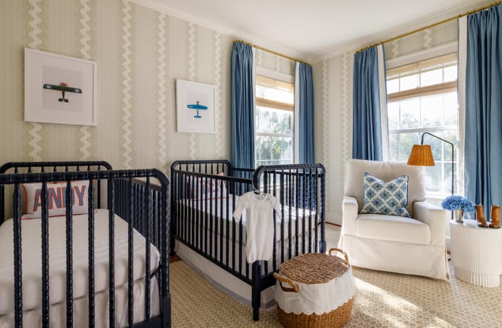 Large nursery with double cribs and framed plane illustrations