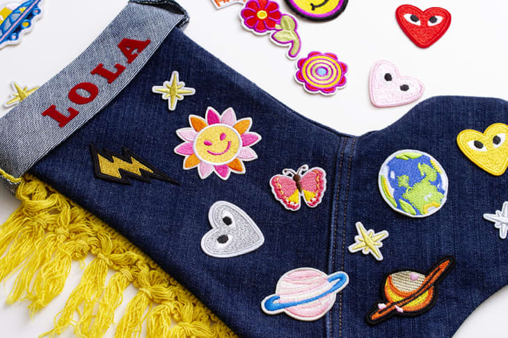 holiday stocking shot with name "Lola" and decals (planets, flowers, suns)