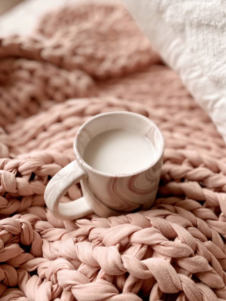 warm sweetened condensed milk on a pink plush weighted blanket