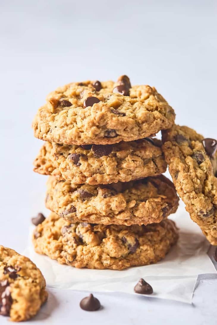 stack of four oatmeal chocolate chip cookies on a bright background