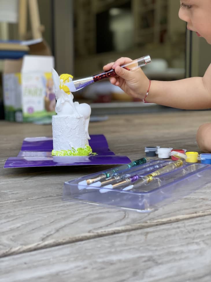 child doing painting craft