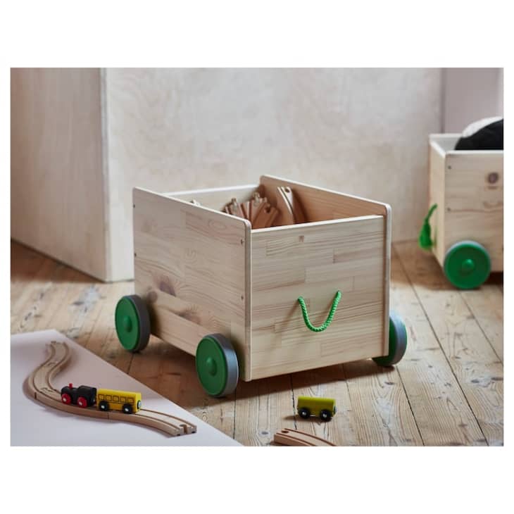 IKEA FLISAT toy storage bin with green wheels