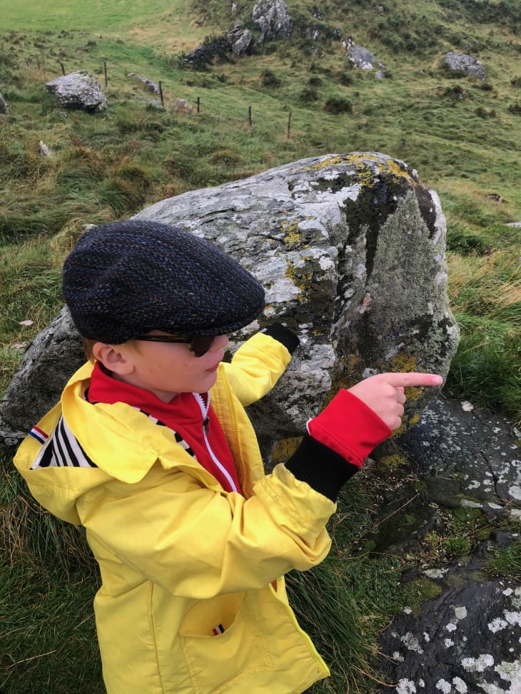 kid in yellow coat exploring Ireland