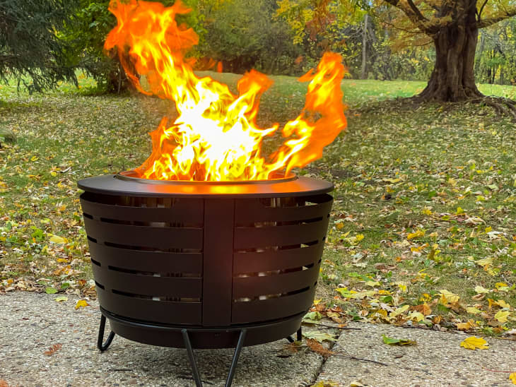 firepit with fire in a backyard or park