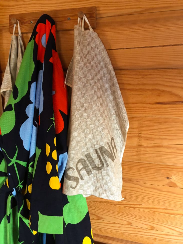 Colorful towels hanging in a cedar sauna