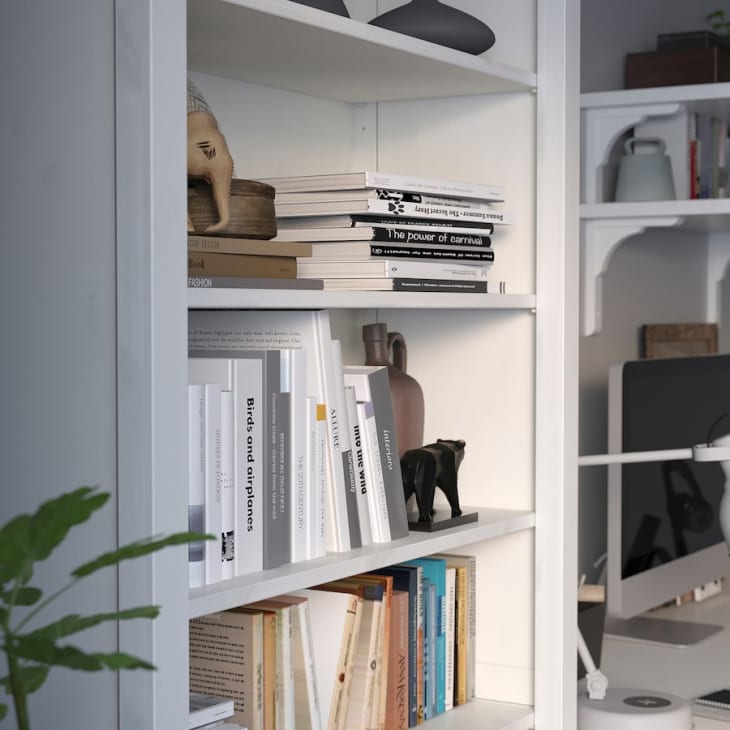 white hemnes bookcase from IKEA with books and light styling