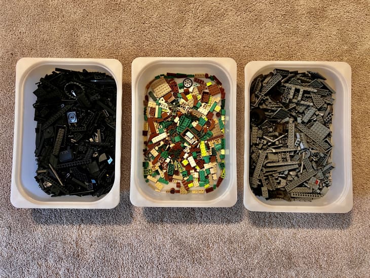 color coded LEGOS in white IKEA trofast bins
