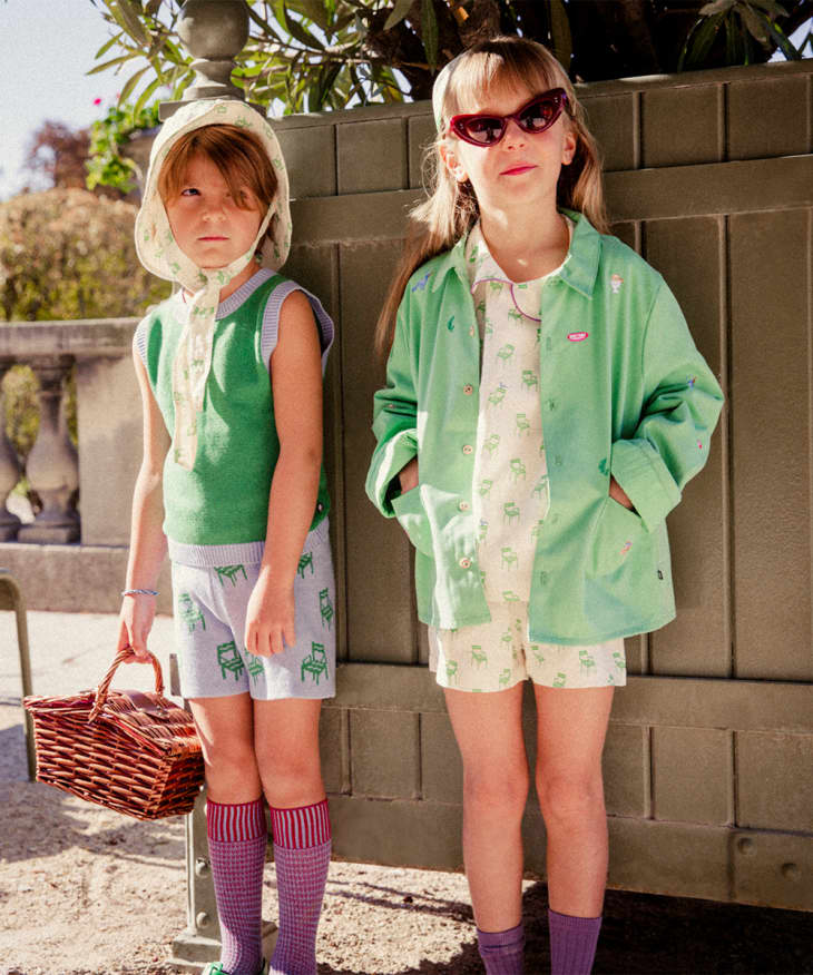 Two kids in green Oeuf clothes