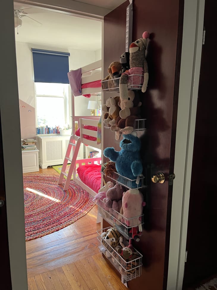 stuffed animals hanging over the door