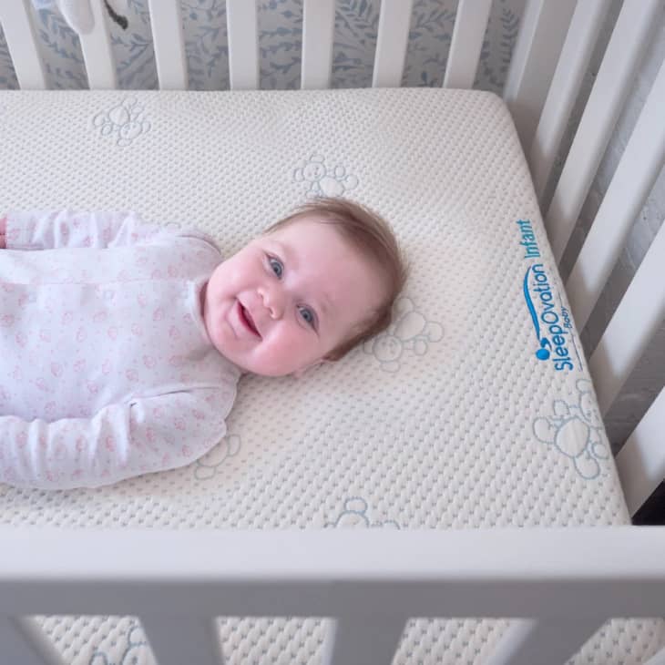 Smiling baby on a SleepOvation mattress