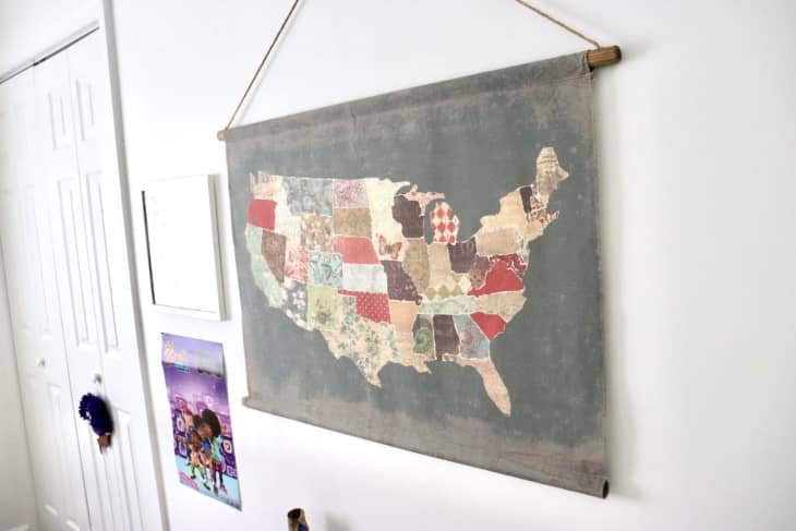 hanging quilt map on a white wall