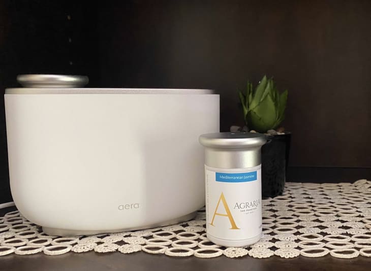 white aera diffuser with scent container on shelf
