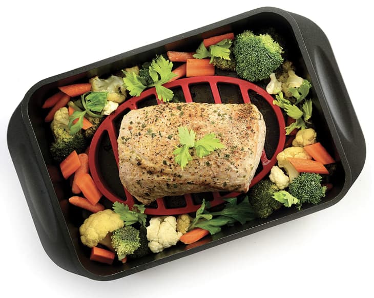 Oval Silicone Roast Rack inside baking pan with meat and veggies