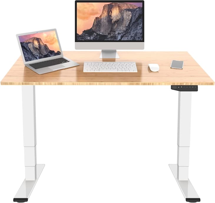 https://cdn.apartmenttherapy.info/image/upload/f_auto,q_auto:eco,w_730/commerce%2FFlexiSpot-Pro-Bamboo-Electric-Standing-Desk-amazon